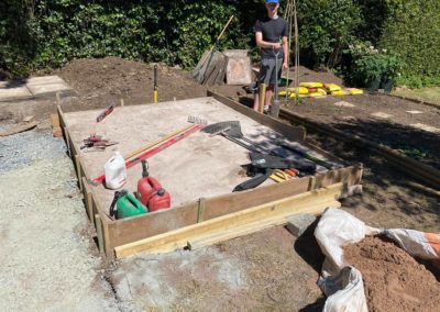 Laying concrete foundation for greenhouse