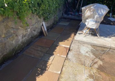 Tiled pathway and Malvern stone wall