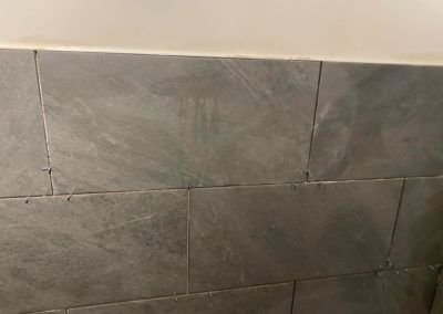 Grey bathroom tiles with spacers
