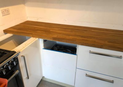 Fitting new kitchen cabinets with wooden counter top