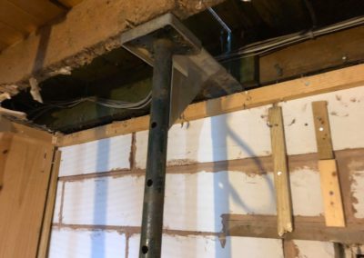 Supporting floor while removing floor joists