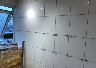 White bathroom tiles with spacers