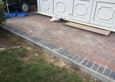 New brick patio with blue brick edge