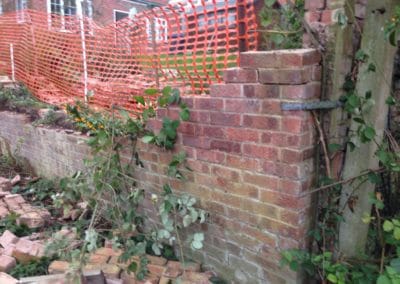 Repairing garden wall collapse
