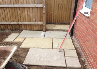 Laying first slabs of patio