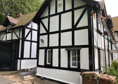 Exterior Painting of Black & White Timber House