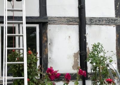 Exterior Painting of Black & White Timber House