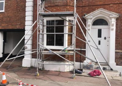 Scaffolding to repair wooden windows