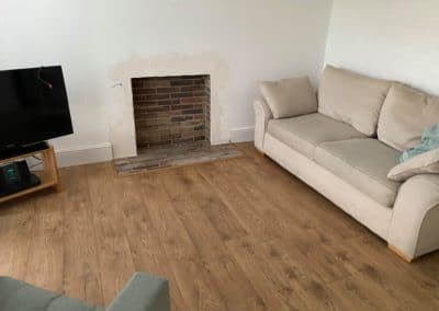 Tiled fireplace with wooden floor