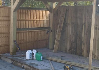 Finishing fencing behind gazebo